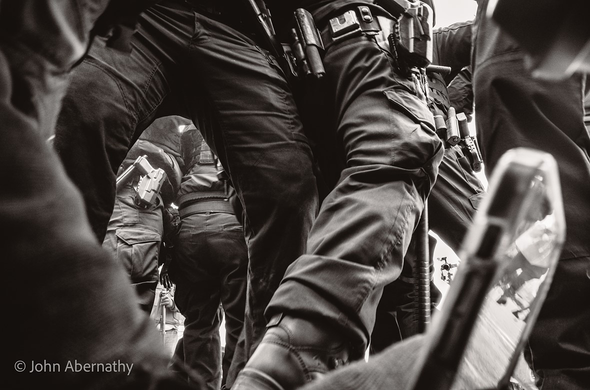 Federal troops surround photographer, from photographer's PoV.   Photo by John Abernathy