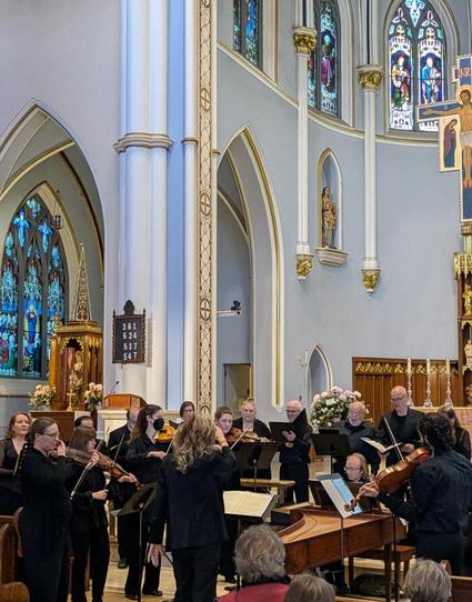 Members of Vancouver's "Belle Voci" vocal group and "Cantare Super Orchestram" early-music ensemble perform in Holy Rosary cathedral.